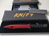a knife that is in a box with a knife in it