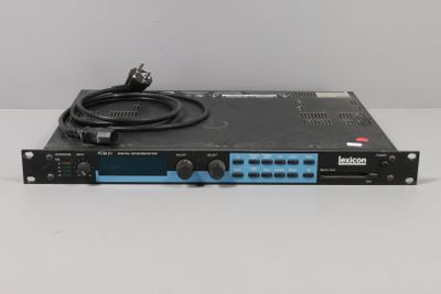 a close up of a black and blue amplifier on a white surface