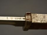 a close up of a knife with a metal handle