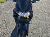 a black motorcycle parked on the side of the road