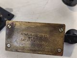 a metal plaque on a table that says kerpplus assorteds