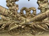 a gold sculpture of two birds on top of a table
