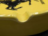ferrari logo on the side of a yellow guitar with a black horse on it