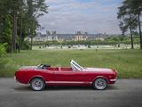 an image of a red convertible car parked on the side of the road