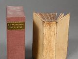 two books sitting next to each other on a gray surface