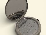an image of a tea strainer on a white surface
