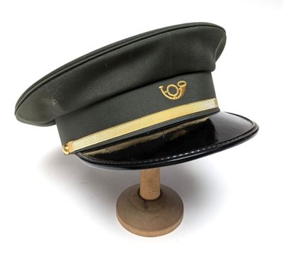 a black hat with a gold logo on it
