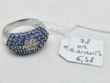 a silver ring with blue stones on it and a price tag
