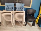 four chairs sitting in front of a chalkboard in a room