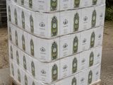 boxes of beer stacked on a pallet in front of a building