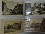 several old black and white photos of a street in a book