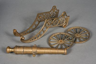 two brass objects that are sitting on a table