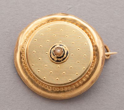an image of a close up of a gold plated pocket watch