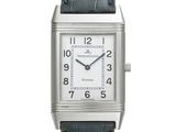 a close up of a silver square watch with a black leather strap