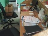 an image of a desk with a lot of clutter on it
