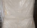 a picture of a mattress that is wrapped up and ready to be shipped
