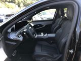 the interior of a car with a black leather seat and a black dashboard