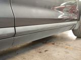 a close up of a car ' s side door with a sticker on it