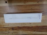 a box of toothbrushes sitting on a wooden table