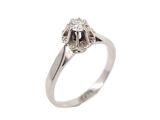 a close up of a diamond ring on a white background