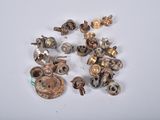 a lot of screws and nuts on a white surface