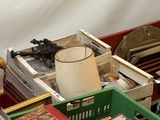 a lot of books and other items on a table