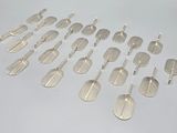 a lot of silver spoons that are on a table