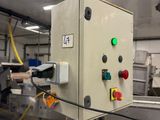 an image of a machine that is working on a piece of wood