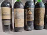 several bottles of wine are lined up on a table