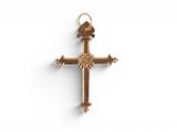 a close up of a cross on a white surface