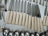 a lot of silver and silverware on the table