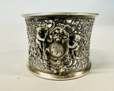 an image of a silver cup with a design on it