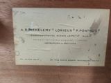 a label on the back of a wooden chair