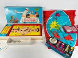 two boxes of children ' s board games are sitting on a table