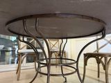 a table and chairs in a room with a glass window