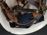 a close up of a helmet that has a bunch of straps on it
