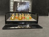 a close up of a display case with four bottles of perfume on it