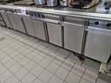 many pots and pans on the counter in the kitchen
