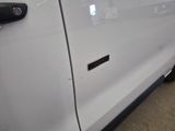 a close up of a door handle on a white truck
