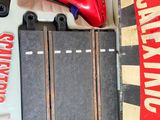 a box with a pair of red shoes and a pair of red shoes in it
