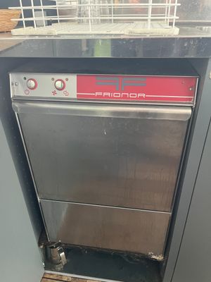 an image of a commercial dishwasher in a kitchen