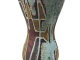 a vase with a design on it on a white surface