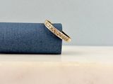 a close up of a gold ring with a message on it