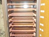 an image of a cabinet that has a bunch of shelves in it