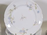many plates stacked on top of each other on a table