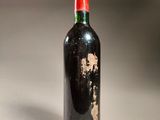 a bottle of wine that is sitting on a table
