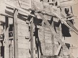 a black and white photo of a building under construction