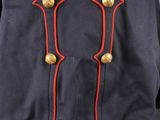 a blue uniform with red trims and buttons on a mannequin