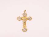 a gold cross pendant with diamonds on a white background