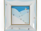 a picture of a plate with a picture of skiers on it